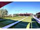 Bocce ball court with artificial turf and shaded seating area for community enjoyment at 5405 S Marigold Way, Gilbert, AZ 85298
