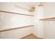 Neat walk-in closet with built-in shelves and a clothes rack at 5405 S Marigold Way, Gilbert, AZ 85298
