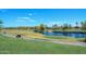 Scenic view of the community golf course with mature landscaping and water feature at 5405 S Marigold Way, Gilbert, AZ 85298