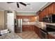 Well-lit kitchen featuring stainless steel appliances and granite countertops at 5405 S Marigold Way, Gilbert, AZ 85298