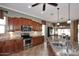 A bright kitchen with stainless steel appliances, granite countertops, and an open layout at 5405 S Marigold Way, Gilbert, AZ 85298