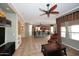 Open-concept living room flows into the kitchen with matching counter tops and decor at 5405 S Marigold Way, Gilbert, AZ 85298