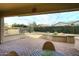 Charming covered patio with a brick floor and a view of the fenced-in yard at 5405 S Marigold Way, Gilbert, AZ 85298
