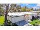 Charming single-story home featuring a well-manicured lawn, garage, and gated front entry at 6143 E Lewis Ave, Scottsdale, AZ 85257