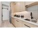 Modern butlers pantry features custom cabinets and stainless refrigerator at 6149 E Voltaire Ave, Scottsdale, AZ 85254