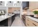 This expansive kitchen features a professional range and high-end stainless appliances at 6149 E Voltaire Ave, Scottsdale, AZ 85254