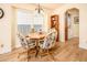 Cozy dining area with natural light, a charming chandelier and adjacent laundry closet at 6161 S Oakmont Dr, Chandler, AZ 85249