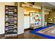 Community lobby with events calendar and display case, leading to the library at 6161 S Oakmont Dr, Chandler, AZ 85249