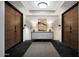 Elegant hallway with modern lighting and a stylish console table at 6166 N Scottsdale Rd # B1005, Paradise Valley, AZ 85253