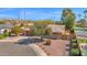 Well-maintained single-Gathering house has a two-car garage and desert landscaping at 6713 N 80Th Pl, Scottsdale, AZ 85250