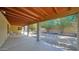 Extended covered patio showcasing the gravel backyard with mature trees and plenty of space for relaxing or entertaining at 6713 N 80Th Pl, Scottsdale, AZ 85250