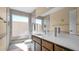 Modern bathroom featuring a walk-in shower with decorative tile, a large mirror, and a sleek vanity at 6713 N 80Th Pl, Scottsdale, AZ 85250