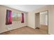 Bedroom with carpet, closet with sliding mirrored doors and window with curtains at 6713 N 80Th Pl, Scottsdale, AZ 85250