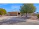 Charming single-story home featuring a well-kept front yard with mature shade trees at 6713 N 80Th Pl, Scottsdale, AZ 85250