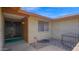 Inviting front entrance with brick exterior, wrought iron security door, and small rock garden at 6713 N 80Th Pl, Scottsdale, AZ 85250