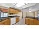 Bright kitchen featuring tile floors, wood cabinets, and an adjacent dining area at 6713 N 80Th Pl, Scottsdale, AZ 85250