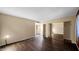 A spacious main bedroom features wood floor, closet with mirrored doors and window at 6713 N 80Th Pl, Scottsdale, AZ 85250