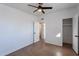 This bedroom features tile flooring, a closet, and a ceiling fan at 683 W Shannons Way, Coolidge, AZ 85128