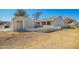 Charming single-story home featuring a low block wall, open carport, and desert landscaping for a welcoming aesthetic at 7018 S 41St Pl, Phoenix, AZ 85042