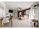 Spacious open-concept living area blending dining and living spaces with ample natural light and modern decor at 7018 S 41St Pl, Phoenix, AZ 85042