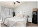 Serene bedroom featuring a neutral color palette, plush bedding, and a cozy, inviting atmosphere at 7018 S 41St Pl, Phoenix, AZ 85042