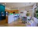 Kitchen and dining area with large window and plenty of seating at 7019 E Thirsty Cactus Ln, Scottsdale, AZ 85266