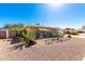 Single-story home featuring desert landscaping, complete with cacti and mature plants, and a well-maintained exterior at 715 N 65Th Pl, Mesa, AZ 85205