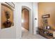 Hallway featuring neutral paint, arched doorways and decorative vases at 7232 E Nance St, Mesa, AZ 85207