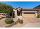 Charming single-story home with a tile roof, desert landscaping, and a two-car garage in a planned community at 7232 E Nance St, Mesa, AZ 85207