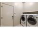 Laundry room featuring a side by side washer and dryer with tile floors at 7232 E Nance St, Mesa, AZ 85207