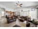 Open-concept living room with tile flooring, ceiling fan, and an eat-in kitchen with stainless steel appliances at 7232 E Nance St, Mesa, AZ 85207