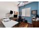 Office with hardwood floors, large window, ceiling fan, and desk at 7232 E Nance St, Mesa, AZ 85207