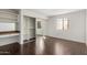 The bedroom features a mirrored closet, a makeup station and dark floors at 7777 E Main St # 258, Scottsdale, AZ 85251