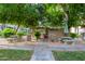 Community BBQ area featuring picnic tables and grills under shady trees. Perfect for outdoor gatherings at 7777 E Main St # 258, Scottsdale, AZ 85251