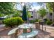 Outdoor picnic area with a grill and seating amidst lush landscaping and community atmosphere at 7777 E Main St # 258, Scottsdale, AZ 85251