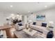 Bright and airy living room featuring hardwood floors, white furniture, and an open floor plan to the kitchen at 7777 E Main St # 258, Scottsdale, AZ 85251