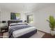 Comfortable bedroom featuring a large window that offers natural light and a plant for decor at 7777 E Main St # 258, Scottsdale, AZ 85251