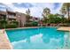 Enjoy the community pool with lush landscaping, seating, and clear blue water at 7777 E Main St # 258, Scottsdale, AZ 85251