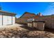 Backyard featuring a built-in outdoor kitchen, stainless steel grill, mini fridge, and sink for entertaining at 7825 W Charter Oak Rd, Peoria, AZ 85381