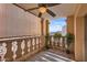 Cozy balcony with ceiling fan, natural lighting, privacy screen, and views of the horizon at 7940 E Camelback Rd # 403, Scottsdale, AZ 85251