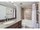 Bathroom features an updated vanity with granite countertop and a shower-tub combo at 7940 E Camelback Rd # 403, Scottsdale, AZ 85251