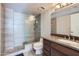 Modern bathroom with a glass shower door, stone counters, and updated vanity at 7940 E Camelback Rd # 403, Scottsdale, AZ 85251