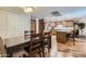 Dining area features a dark wood table and chairs, and access to the kitchen at 7940 E Camelback Rd # 403, Scottsdale, AZ 85251