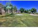 Scenic view of a well-maintained golf course surrounded by lush greenery and tall trees at 7940 E Camelback Rd # 403, Scottsdale, AZ 85251
