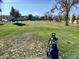 Lush green golf course with a golf bag visible in the foreground at 7940 E Camelback Rd # 403, Scottsdale, AZ 85251