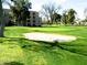 A beautiful golf course view with green putting areas and a sand bunker at 7940 E Camelback Rd # 403, Scottsdale, AZ 85251