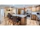 Kitchen with stainless steel appliances, an island with barstool seating and dining room access at 7940 E Camelback Rd # 403, Scottsdale, AZ 85251