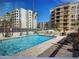 Relax by the refreshing outdoor pool, surrounded by lounge chairs and tables for ultimate comfort at 7940 E Camelback Rd # 403, Scottsdale, AZ 85251