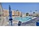 Outdoor pool with lounge chairs and umbrellas, perfect for relaxation and enjoyment at 7940 E Camelback Rd # 403, Scottsdale, AZ 85251
