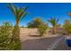 The backyard is drought resistant with gravel and trees at 817 S 123Rd Dr, Avondale, AZ 85323